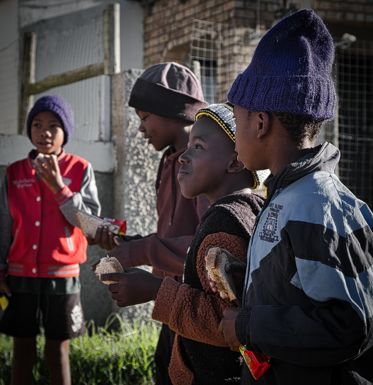 Children eating together on the route