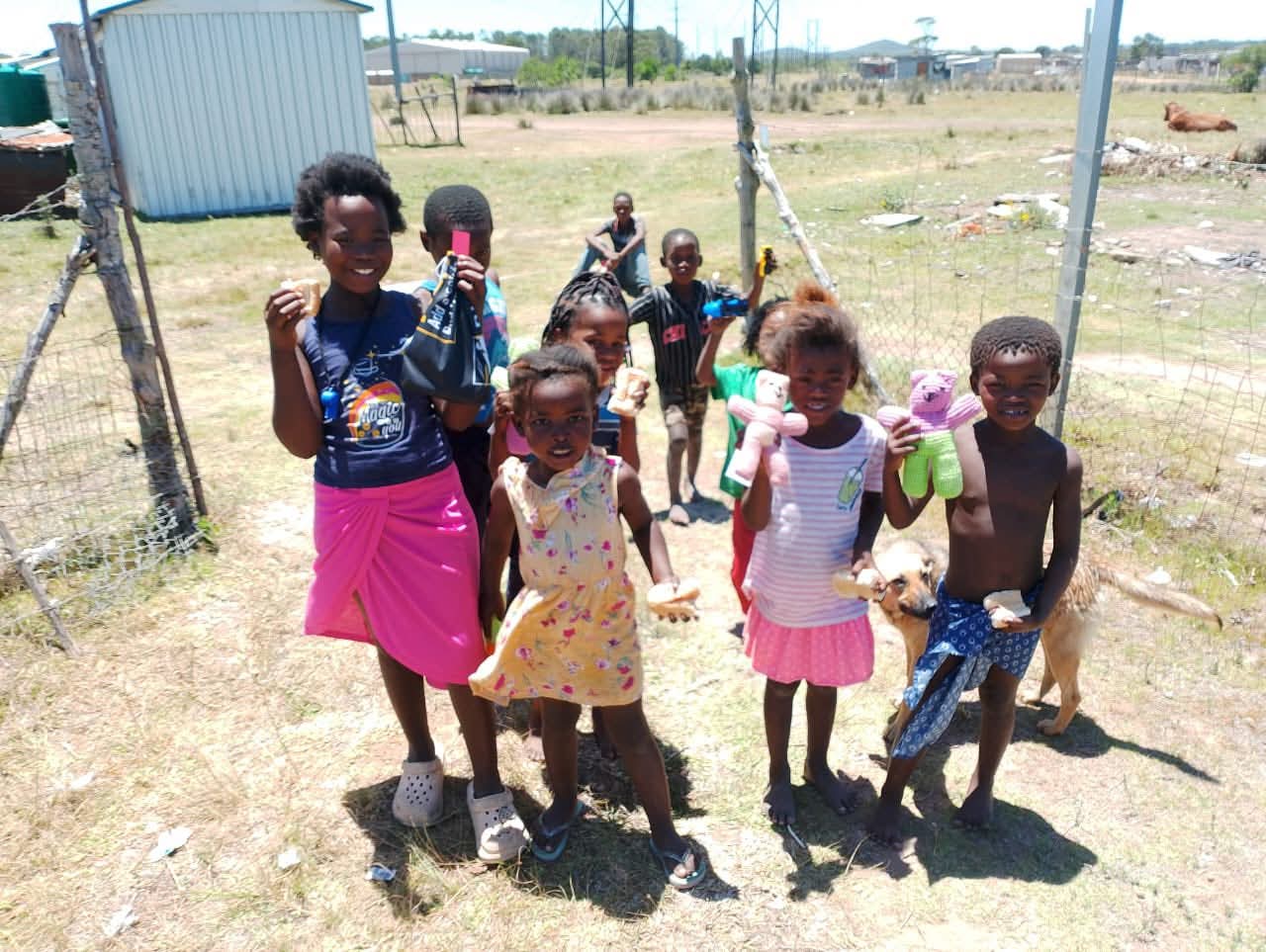 Children receiving toys and snacks